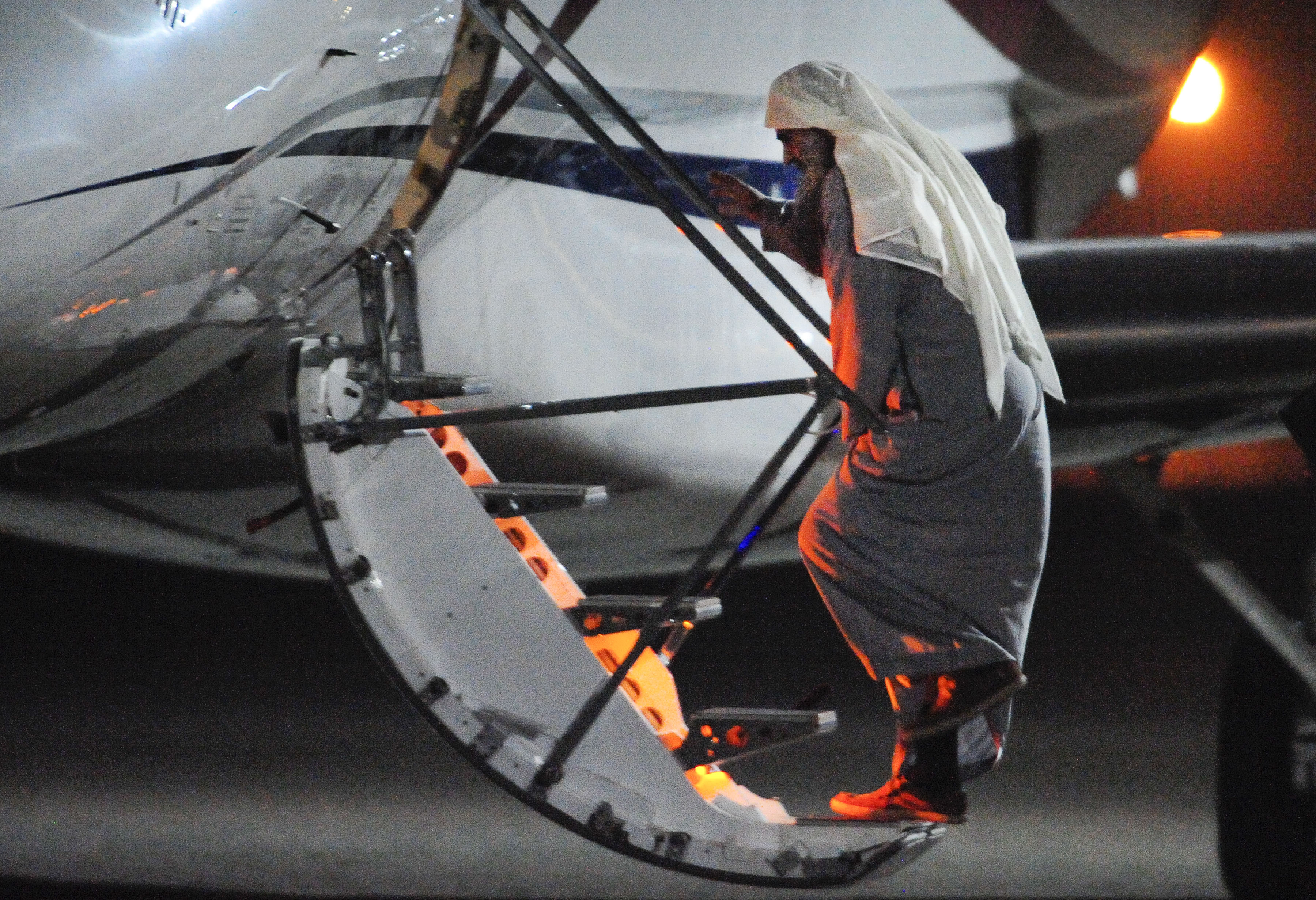 abu-qatada-boards-plane-001.jpg